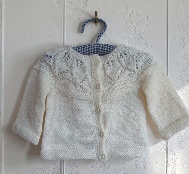 Hand- knitted baby jumper. Approx 0 to 3 mths. 50% wool.All proceeds to The Stroke Association