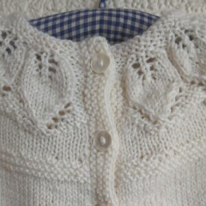 Hand- knitted baby jumper. Approx 0 to 3 mths. 50% wool.All proceeds to The Stroke Association