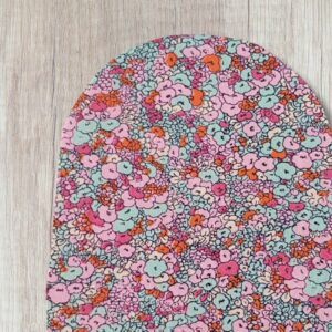 Handmade pink floral stoma bag cover with pastel pink, mint green, orange and cream flowers in a pretty busy floral print.