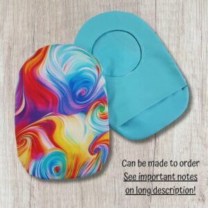 Two handmade stoma bag covers on a wooden background, showing a bright rainbow marbled patterned front cover and a plain turquoise reverse cover with an opening, with text saying can be made to order.
