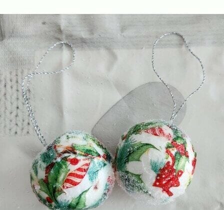 Set of 2 decoupaged polystyrene baubles, with holly and candy striped baubles design