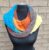 Hand-Knitted Multi-Colored Yarn Cake Snood for a Cozy and Bright Look