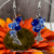 Handmade Silver Butterfly Drop Earrings with Blue Faceted Glass Bead Cluster.