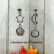 Handmade Mis-matched dangle/drop Earrings with Moon and Star design and White Foiled Resin.