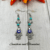 Handmade Drop Earrings with Silver Evil Eye Hamsa Charms and Turquoise Howlite Gemstone Beads.