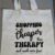Shop sustainably with our natural recycled cotton tote bag featuring a motivational quote – Shopping is Cheaper Than Therapy