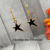 Black gold-filled asymetrical Star Charm Earrings