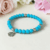 Dyed Turquoise Beaded Bracelet With Flower Charm