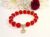 Red Sparkly Beaded Bracelet with 18K Gold-Plated Celtic Knot Charm