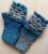 Pair of crocheted fingerless gloves in a dragon scales design.. All proceeds to The Stroke Association