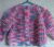 Hand knitted baby cardigan. Pink. Approx 6 to 12 mths. Proceeds to The Stroke Association