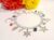 Silver Plated Chakra Charm Bracelet with Assorted Charms and Toggle clasp